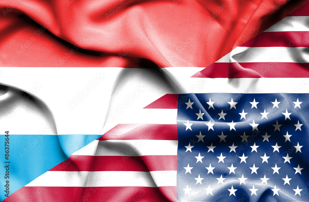 Fototapeta premium Waving flag of United States of America and Luxembourg