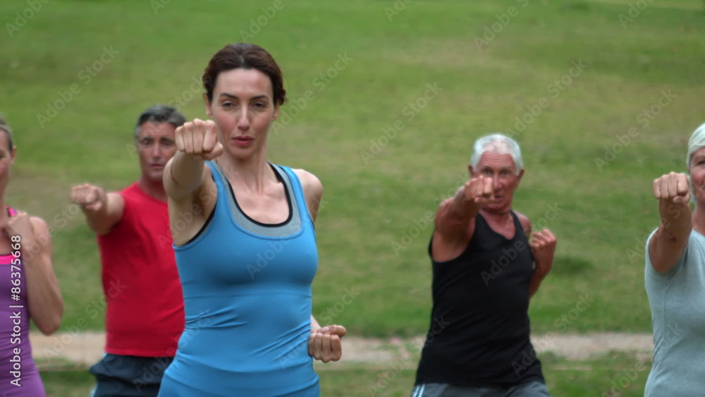 Athletic group showing their fists Athletic group showing their fists