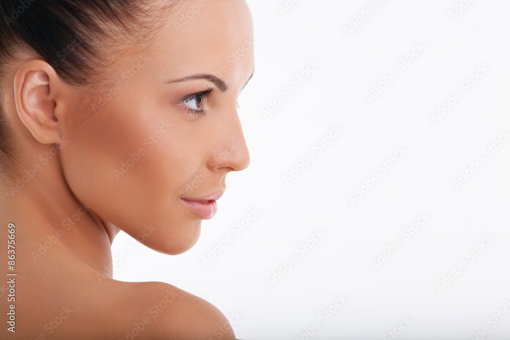 Cheerful healthy woman is presenting her skin Cheerful healthy woman is presenting her skin