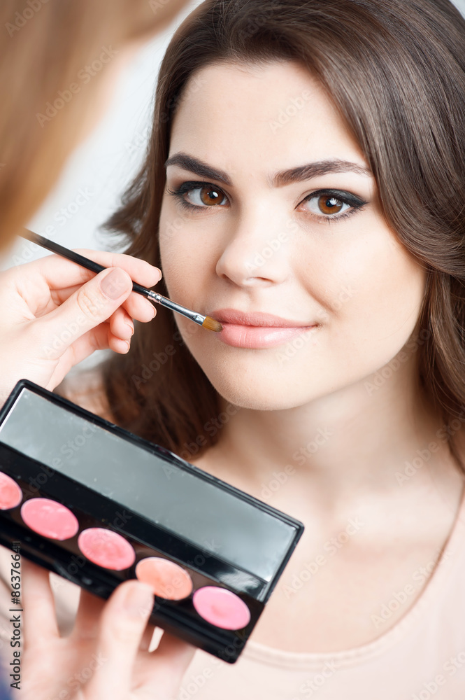 Pretty young woman is preparing for meeting Pretty young woman is preparing for meeting