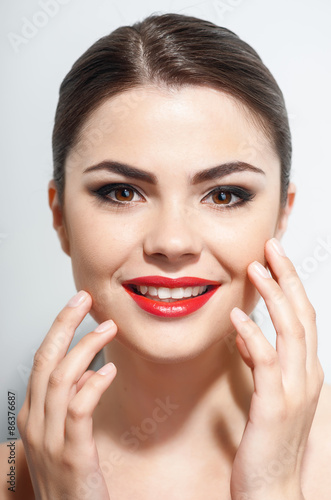 Attractive young woman is presenting her make-up