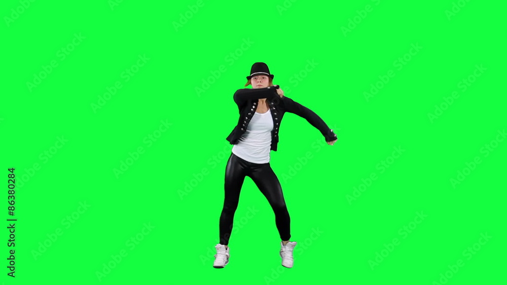Girl in the hat dancing like the king of pop. Chroma key background. Young woman dancing against a green background
Girl in the hat dancing like the king of pop. Chroma key background. Young woman dancing against a green background