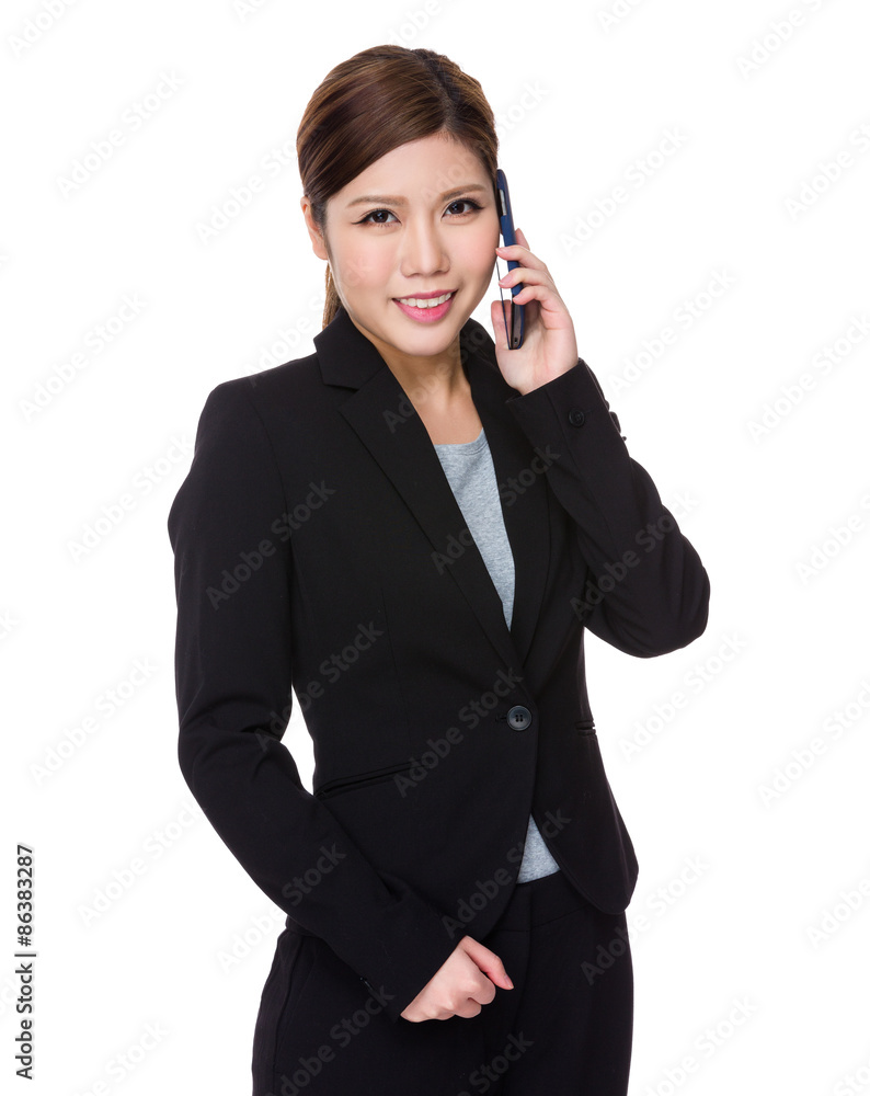Asian businesswoman talk to cellphone Asian businesswoman talk to cellphone