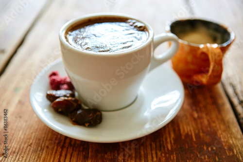 Cup of coffee on a wooden background
