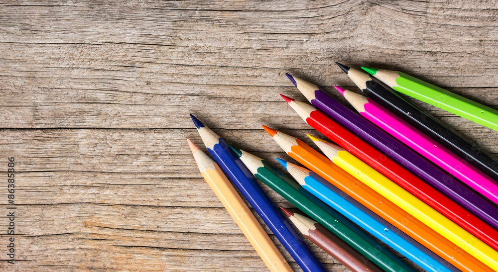 Color Pencils on wooden background. Color Pencils on wooden background.