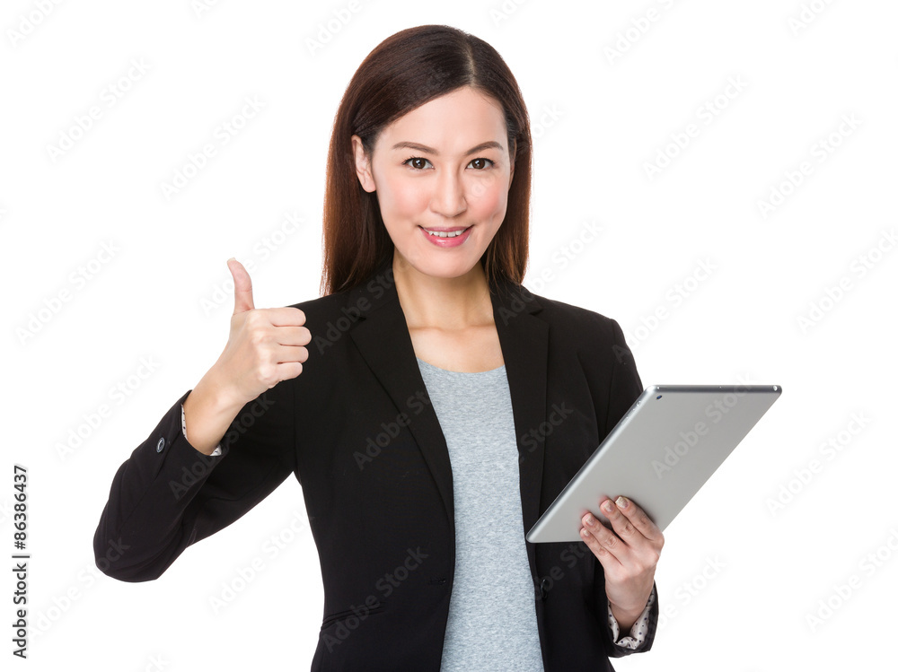 Businesswoman holding with tablet pc and thumb up Businesswoman holding with tablet pc and thumb up