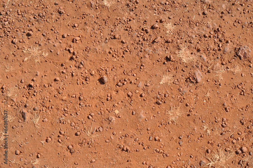 Tread marks on the ground. Red Earth background Tread marks on the ground. Red Earth background