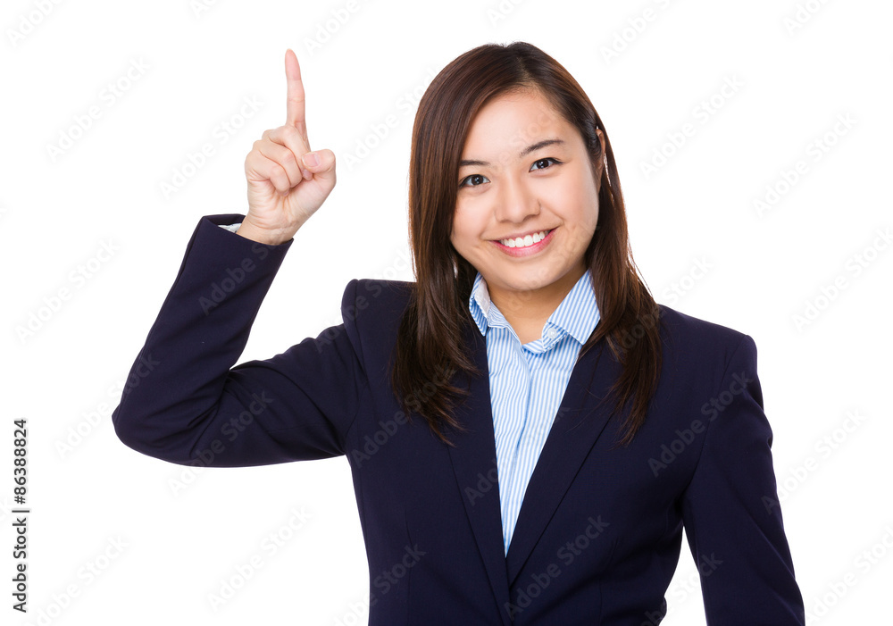Asian businesswoman with finger showing upwards Asian businesswoman with finger showing upwards