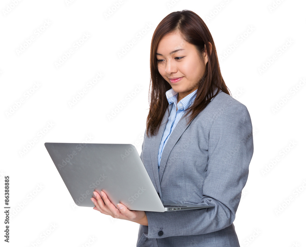 Young businesswoman use of the laptop computer Young businesswoman use of the laptop computer
