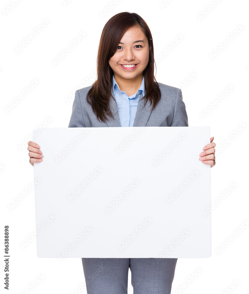 Asian businesswoman holding a white banner Asian businesswoman holding a white banner