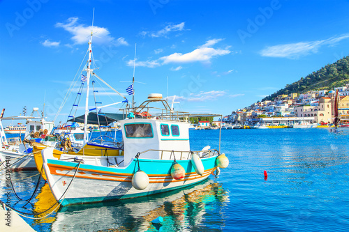Colorful boats over clear water in peaceful Greek bay, Greece