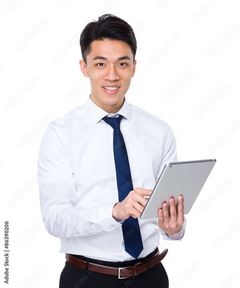 Asian businessman use of the tablet pc Asian businessman use of the tablet pc