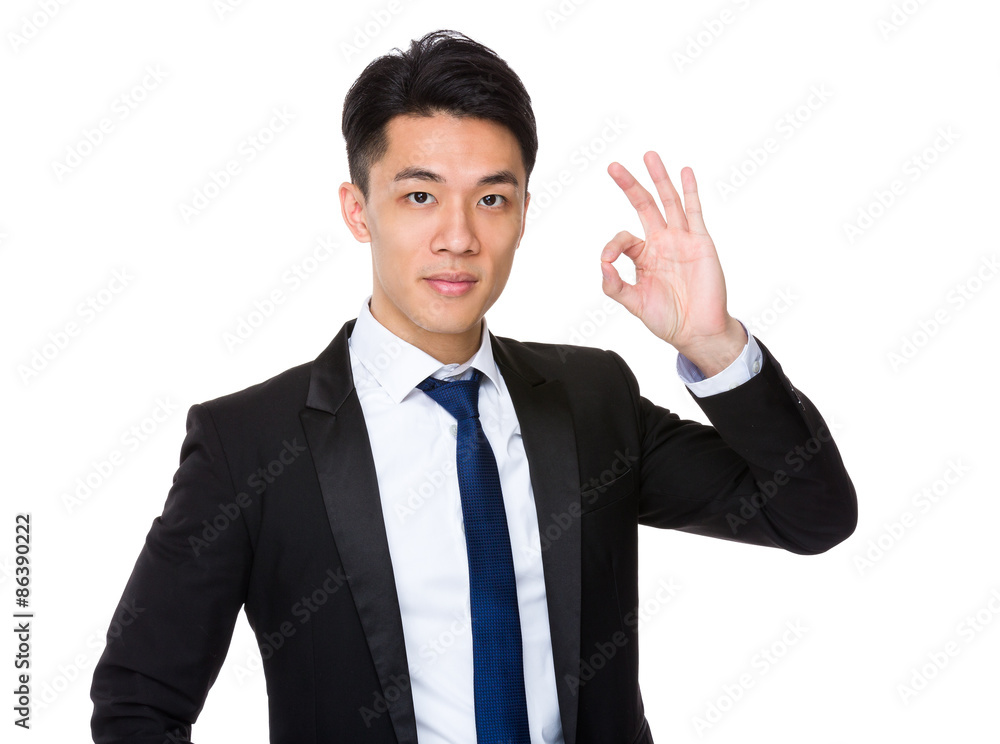 Asian businessman with ok sign gesture Asian businessman with ok sign gesture