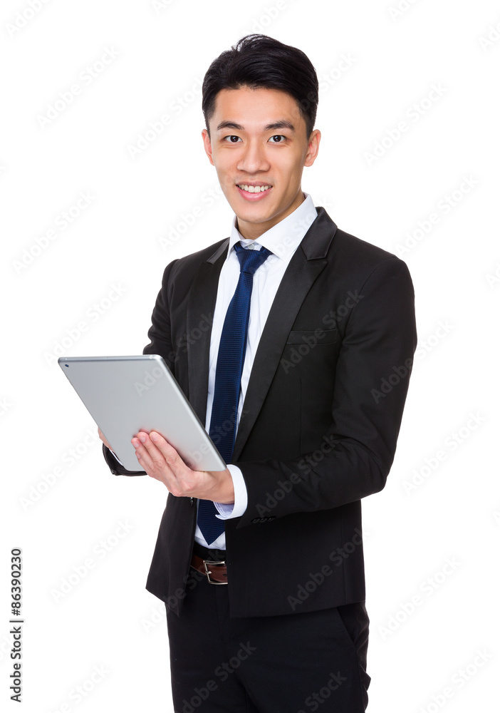 Young businessman use of the digital tablet Young businessman use of the digital tablet