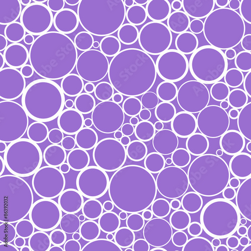 Cheerful abstract seamless print of randomly scattered rings