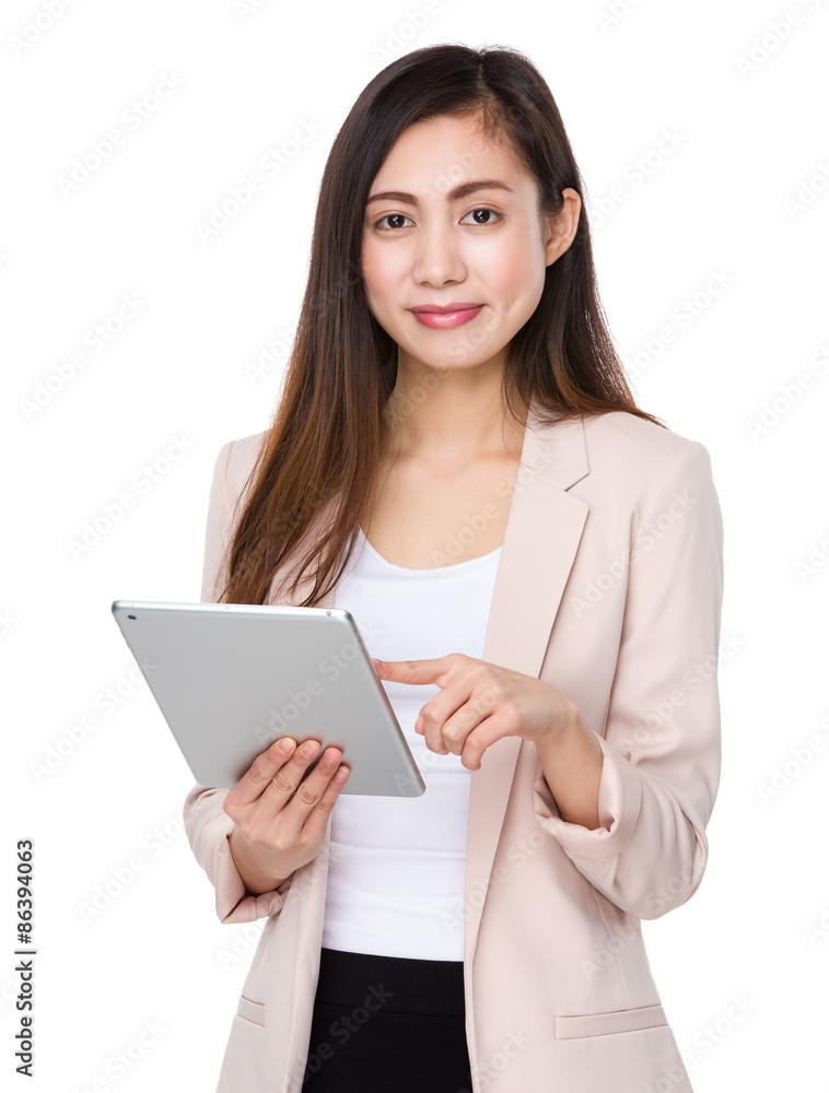 Asian businesswoman use of the tablet pc Asian businesswoman use of the tablet pc