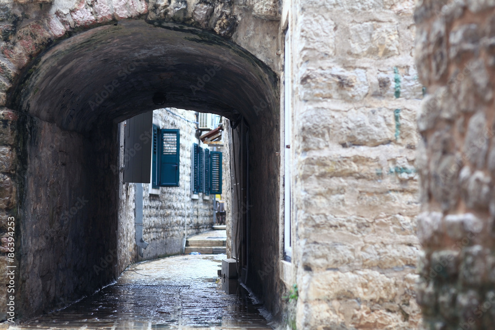 Fototapeta premium paved street stone walls Europe