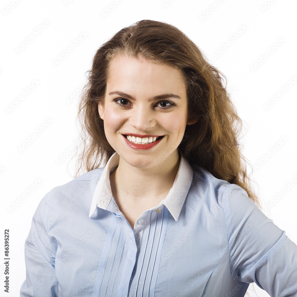 Portrait of a beautiful smiling young woman dressed in a blue sh Portrait of a beautiful smiling young woman dressed in a blue sh