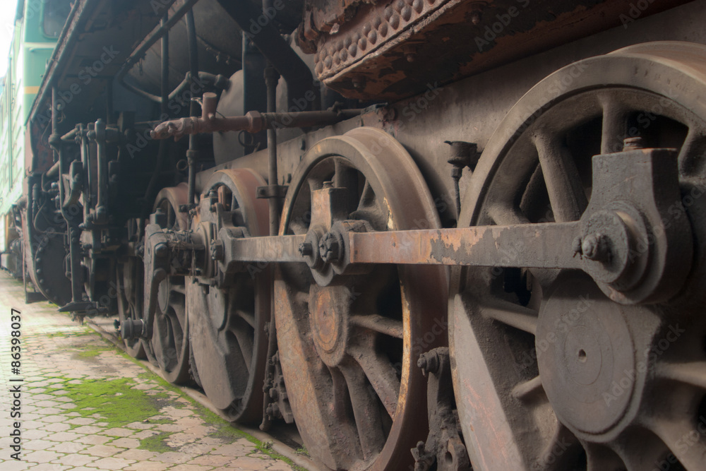 The wheels of a steam locomotive