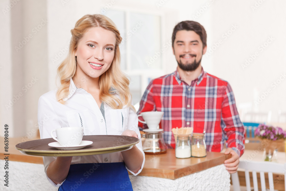 Waitress with tray on background of customer Waitress with tray on background of customer