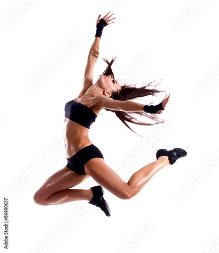 Stylish and young modern style dancer jumping 
