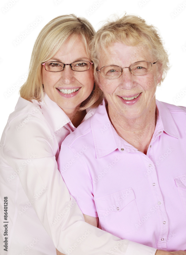 Middle aged woman with her senior mother on a white background. Middle aged woman with her senior mother on a white background.