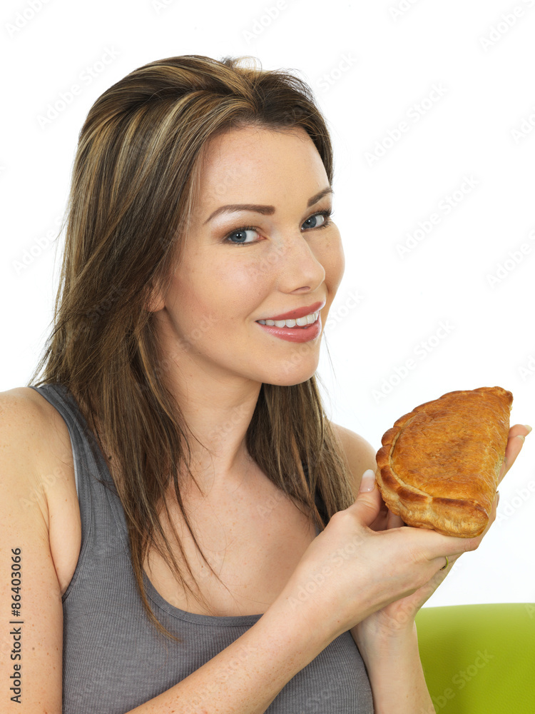 Attractive Young Woman Holding a Baked Cornish Pasty Attractive Young Woman Holding a Baked Cornish Pasty
