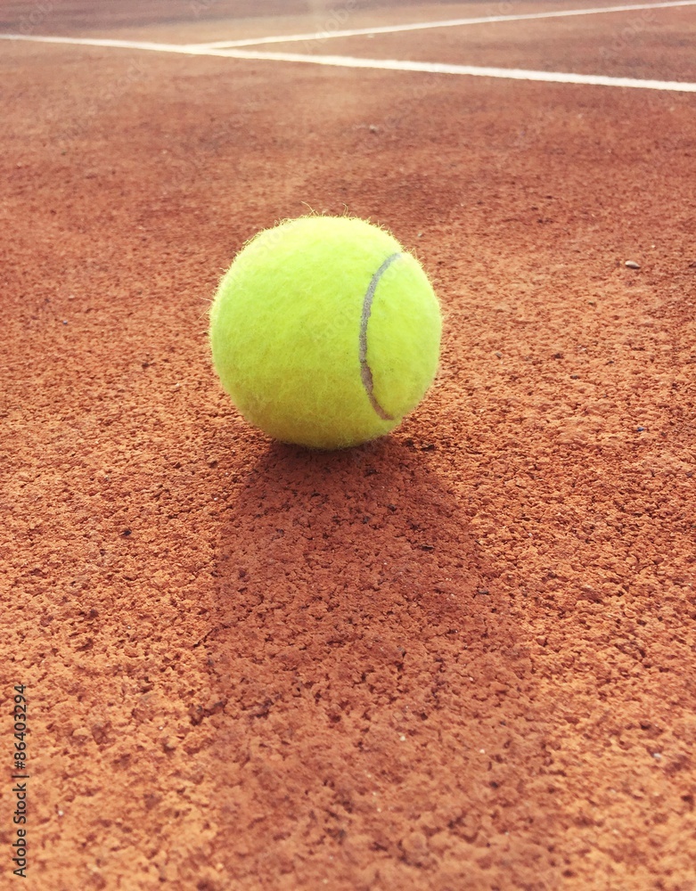 Tennis ball on tennis court