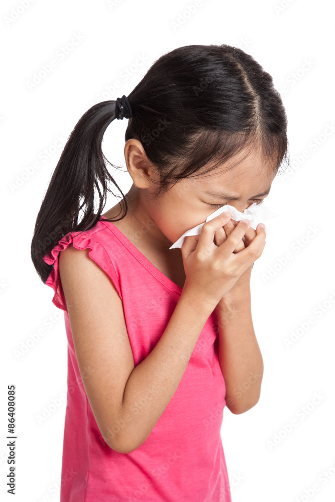 Little asian girl sneeze with napkin paper
