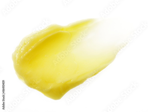 Yellow color skincare balm on background photo