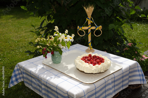 Homemade cake at a decrated table photo