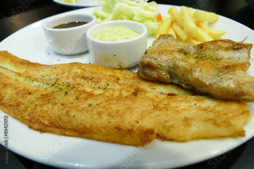 fish steak and grilled chicken with sauce