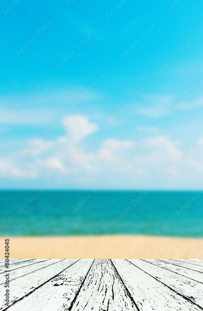 Blurred image of sea sky with wooden under for put products Blurred image of sea sky with wooden under for put products