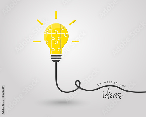 Bright lightbulb made of puzzle pieces as idea and solution concept