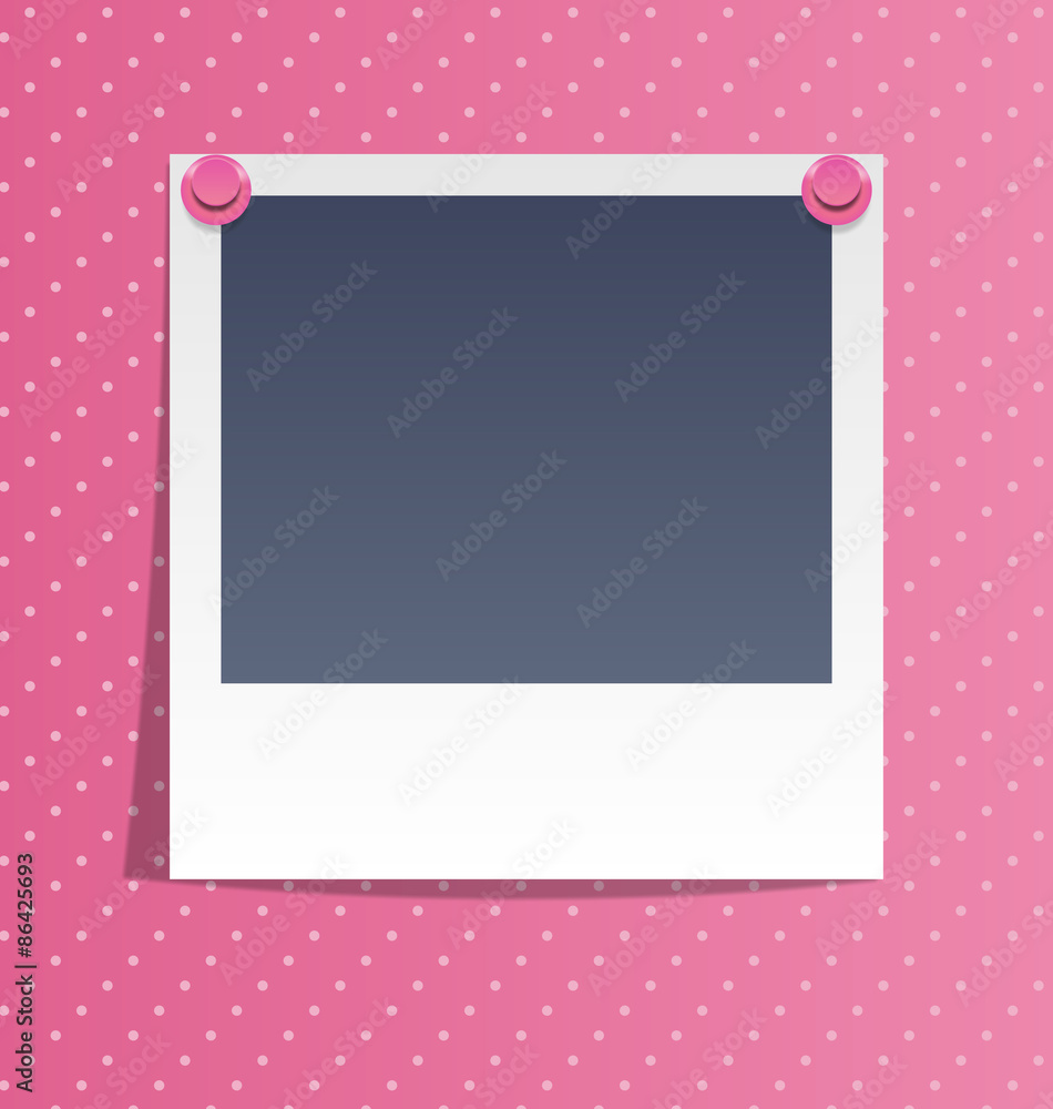Photo frame on wall with pink pins on pink background
