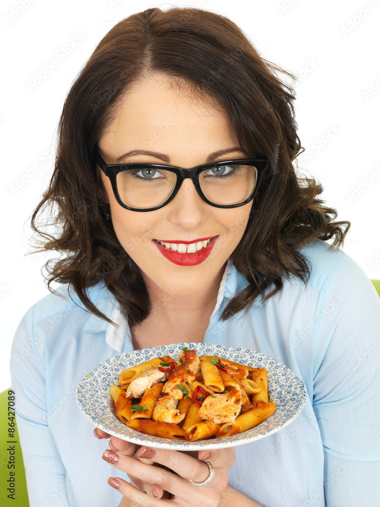 Young Woman Wearing Glasses Holding and Eating Penne Pasta Young Woman Wearing Glasses Holding and Eating Penne Pasta