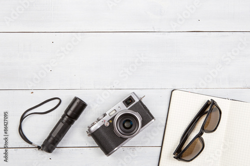 Set of cool travel stuff on wooden table