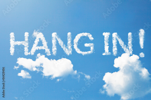 hang in word in capital letter on blue sky