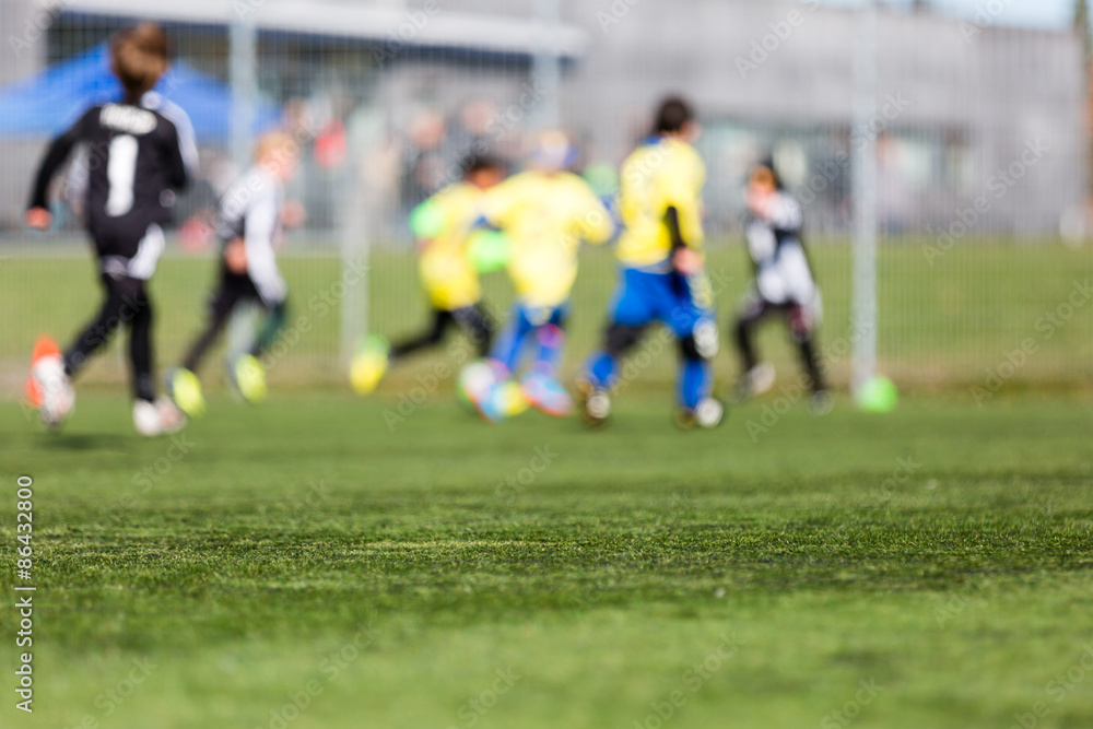 Fototapeta premium Blurred Kids Playing Soccer