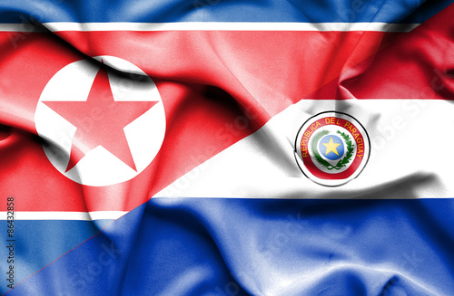 Waving flag of Paraguay and North Korea