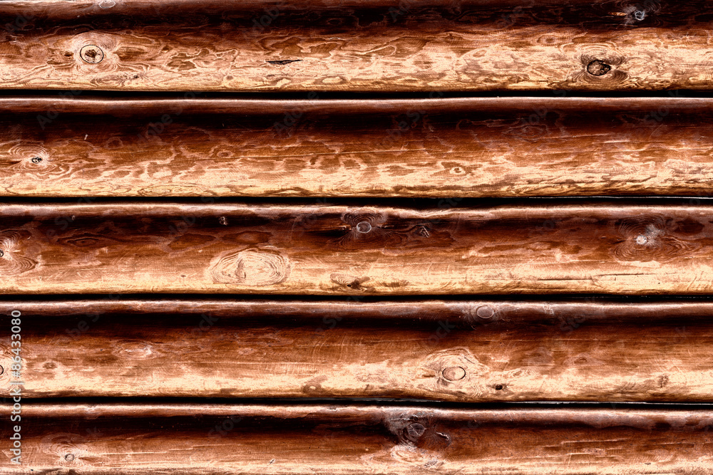Wooden texture of brown color with scratches and cracks, which can be used as a background Wooden texture of brown color with scratches and cracks, which can be used as a background