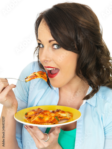 Pretty Attractive Young Woman Holding and Eating a Plate of Ravioli