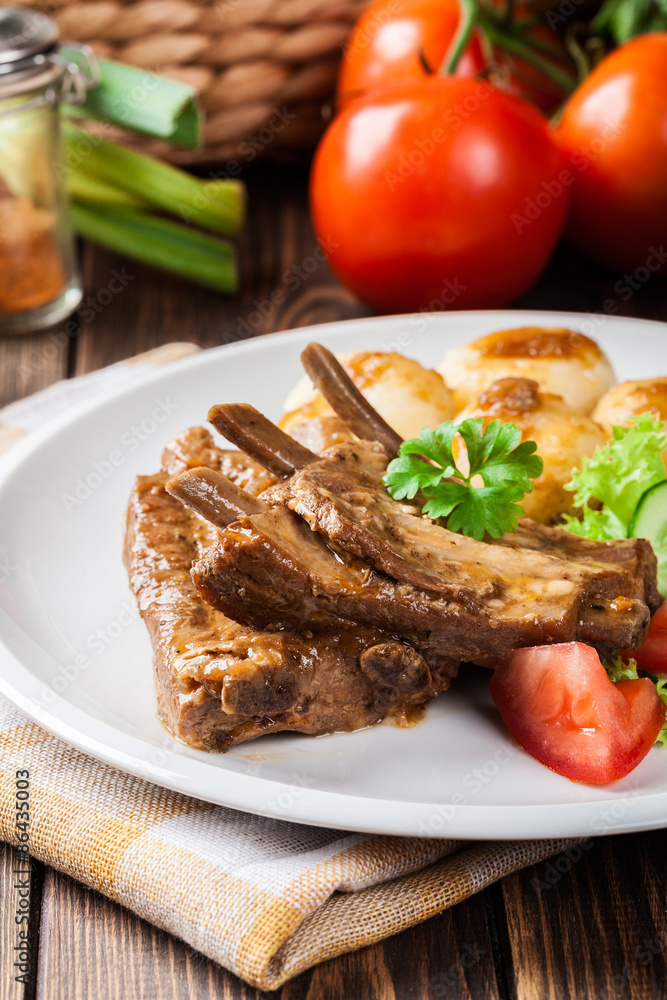 Pork spareribs served with silesian noodles and sauce Pork spareribs served with silesian noodles and sauce