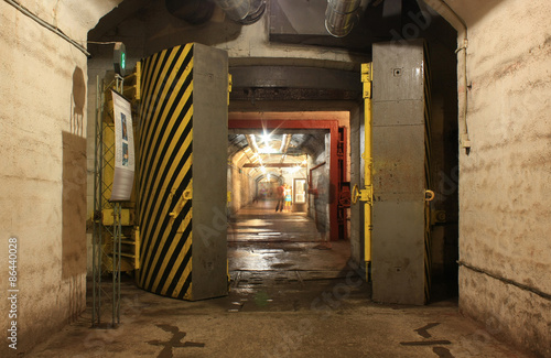 Yellow hermetic door in the underground tunnel