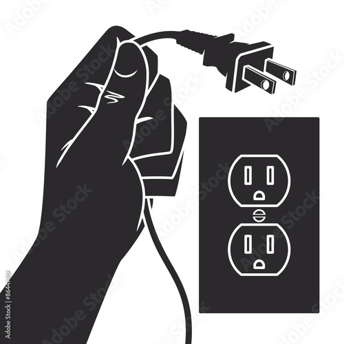 Hand holding electric plug