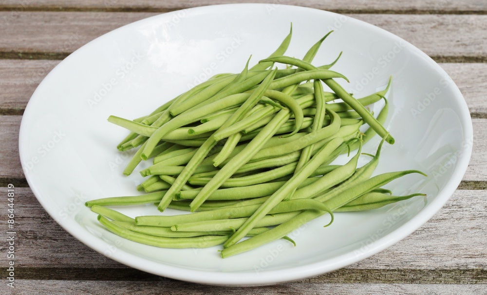 Plate of French green beans freshly picked from the vegetable garden Plate of French green beans freshly picked from the vegetable garden