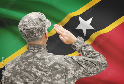 Soldier in hat facing national flag series - Saint Kitts and Nevis photo