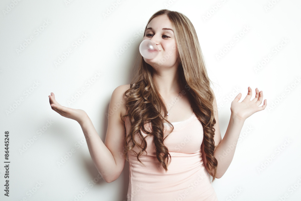 blond teenager girl blowing a bubble gum balloon blond teenager girl blowing a bubble gum balloon