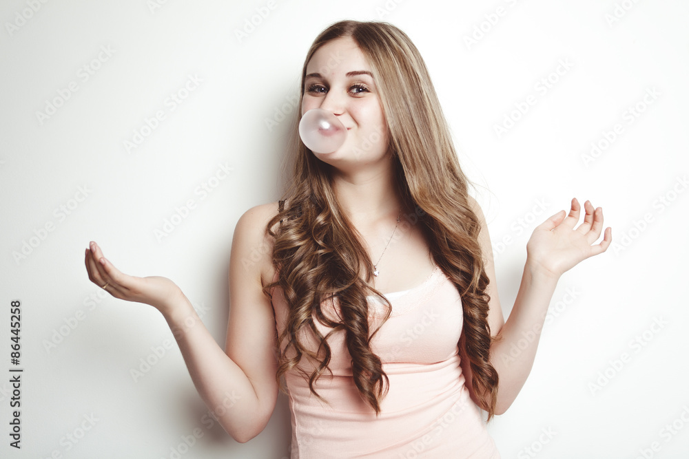blond teenager girl blowing a bubble gum balloon blond teenager girl blowing a bubble gum balloon