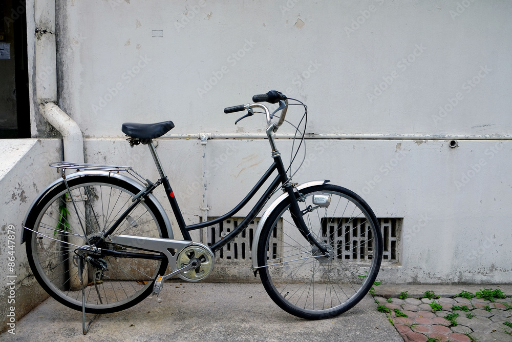 Old black bicycle in vintage style